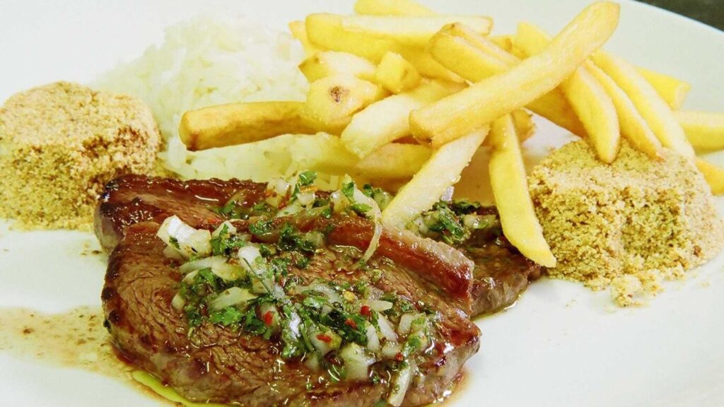 Picanha Chimichurry com farofa arroz branco e batatas fritas